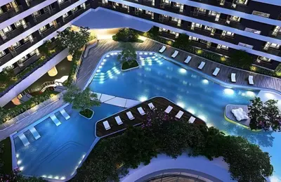 an overhead view of a large apartment building with a swimming pool at The Urban Crib SMDC Residences Makati in Manila