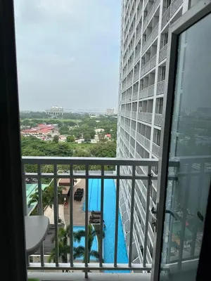 a view of a pool from a building at Sweet Villa SMDC Breeze Residences Pasay in Manila