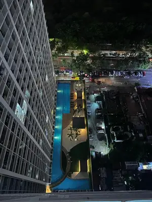 a pool in the middle of a building at Sunset heights SMDC Breeze Residences Pasay in Manila