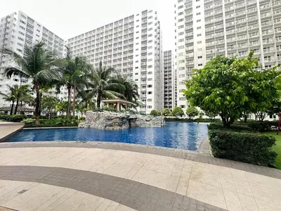 a swimming pool in a city with tall buildings at Pyeong on Suite SMDC Shore Residences Mall of Asia Pasay in Manila