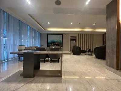 a meeting room with a table and chairs in a building at Pyeong on Suite SMDC Shore Residences Mall of Asia Pasay in Manila