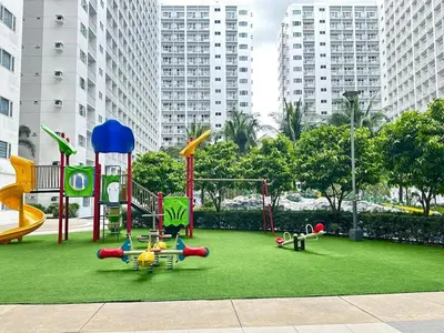 a playground in a city with buildings in the background at Pyeong on Suite SMDC Shore Residences Mall of Asia Pasay in Manila