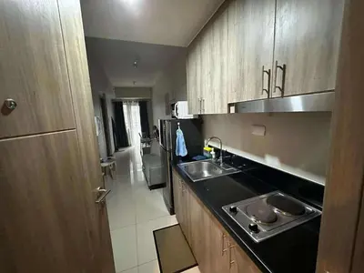 a kitchen with a sink and a counter top at S Residences Tower 1 - near MOA & Ayala Malls Manila Bay in Manila