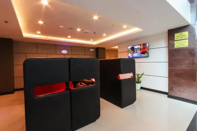 a black refrigerator with its door open in a room at Hotel Sogo Baclaran in Manila
