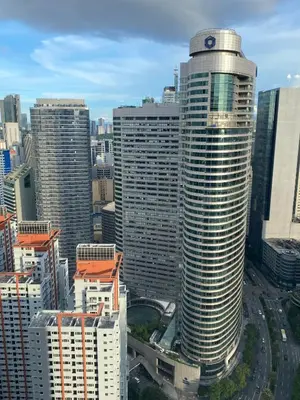 a view of a tall building in a city at City View Skyline - Air Residence in Manila