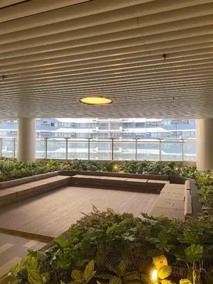 a large building with a lobby with plants at City View Skyline - Air Residence in Manila