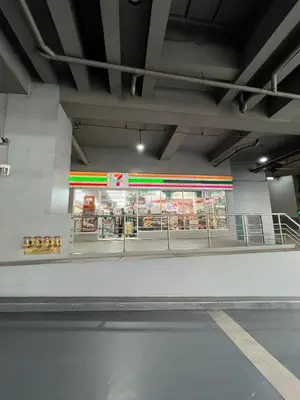 a subway station with a store with red and green lights at Osaka Theme LRT Gilmore Robinsons Magnolia Free Netflix Internet Pool in Manila