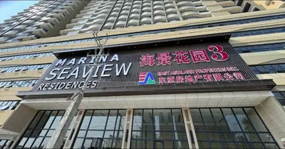 a sign on the side of a building at Sy bay Suites TwinBed near Okada MOA PITX NAIA cod MSV1502H in Manila