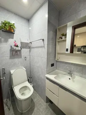 a bathroom with a toilet and a sink at Sy bay Suites TwinBed near Okada MOA PITX NAIA cod MSV1502H in Manila