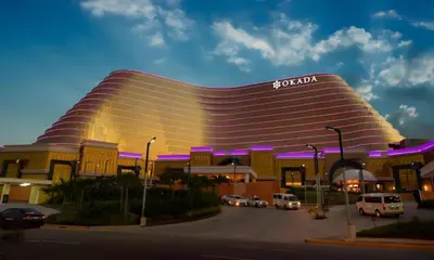 a large building with a scientology sign on it at Sy bay Suites Okada NAIA T3 T1 Airport MOA COD DFA MSV1506H in Manila