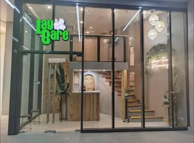 a store window with a juz pane sign on it at Cozy Escape by Dave 4265 in Manila