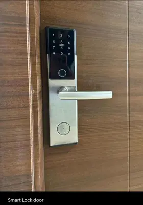 a metal door handle on a wooden door at Cozy Escape by Dave 4265 in Manila