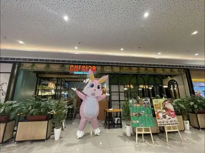 a store with a pink mascot in front of a store at Cozy Escape by Dave 4265 in Manila