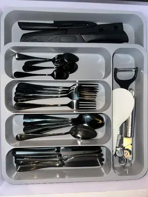 a white tray with utensils in a drawer at Casa Forma in Manila