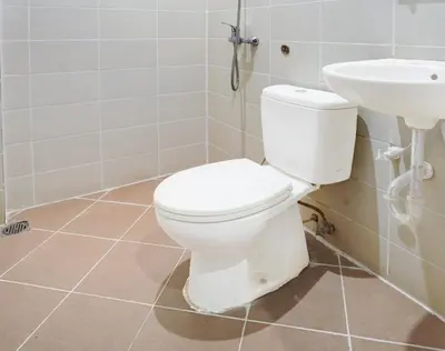 a bathroom with a toilet and a sink at OYO 1175 Casa Ana in Manila