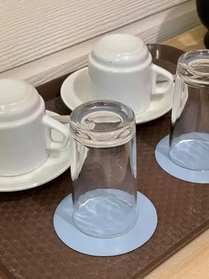 a tray with three glass jars and plates on a table at airobedz ZOBEL ROXAS- A Value Hotel in Manila