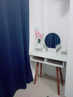 a bathroom with a white vanity with a mirror on it at Condo MOA Complex Pasay - Shore 1 Tower D Residence - Home away from Home in Manila