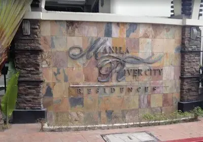 a sign on the side of a building at Casa Tolentino Manila in Manila