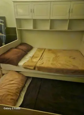 two bunk beds sitting in a room withermottermott at Casa Tolentino Manila in Manila