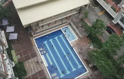 an overhead view of a large blue swimming pool at Casa Tolentino Manila in Manila