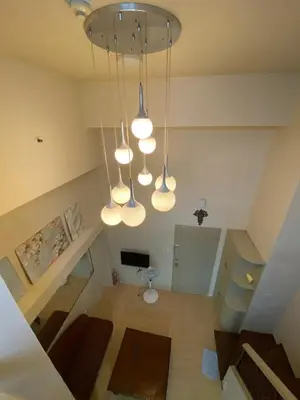 an overhead view of a living room with lights at Whereabouts Midway Condotel in Manila