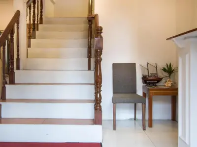 a stairway with a chair and a desk at Makati Riverside Inn in Manila