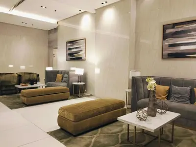 a living room with couches and a couch and a table at NAIA Manila Airport - Newport Prime Accommodations in Manila