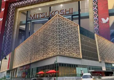 a building with a large structure in front of it at Upscale 2BR in Uptown Parksuites with Free Parking in Manila