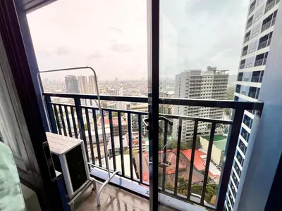 a balcony with a view of a city at Skyline Serenity Designer 1BR with Balcony at Air in Manila