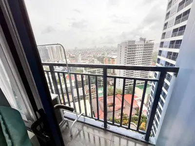 a balcony with a view of a city at Skyline Serenity Designer 1BR with Balcony at Air in Manila