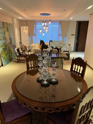 a dining room table with wine glasses on it at Super cozy Family Villa in Manila