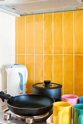 a frying pan sitting on top of a stove at The Play Haus Aesthetic Studio across NAIA Terminal 3 in Manila