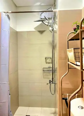 a shower with a glass door in a bathroom at Casa Felice at Shore 2 Residences in Manila