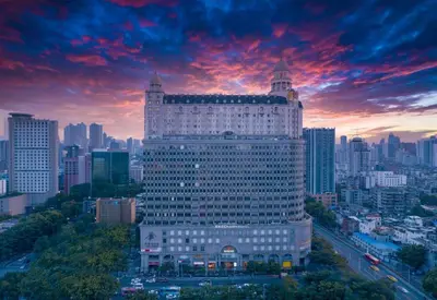 a large white building in the middle of a city at suxi in Bacoor