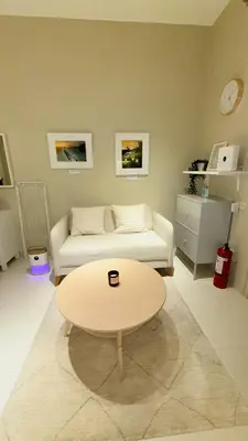 a living room with a couch and a coffee table at Best Value-Beautiful 1BR in the Heart of Makati w WiFi, washer-dryer, pool & gym in Manila