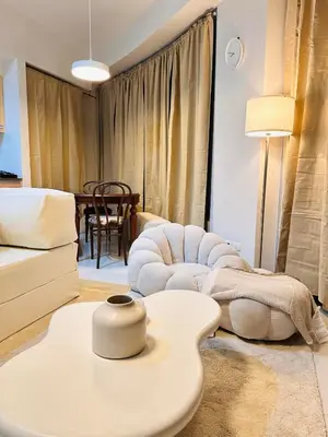 a living room with a couch and a table at The Dreamy Cloud by Kozy Mood in Manila