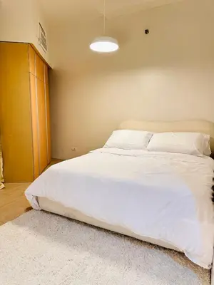 a bedroom with a large white bed in a room at The Dreamy Cloud by Kozy Mood in Manila