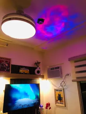 a room with a ceiling with a light and a computer monitor at Dos Staycation Urban Deca Cubao in Manila