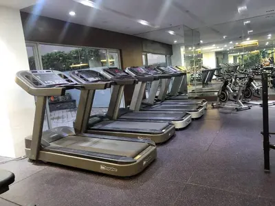 a row of treadmills in a gym at Singapore Theme Sunshine 100 Tower 3 Pioneer Free Pool Gym Internet Netflix in Manila
