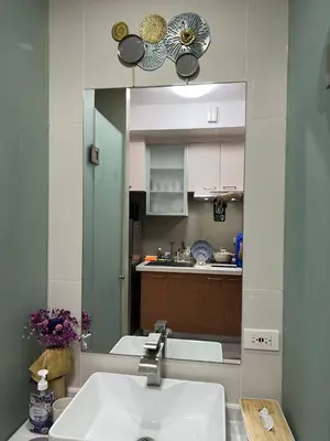 a kitchen with a sink and a large mirror at Singapore Theme Sunshine 100 Tower 3 Pioneer Free Pool Gym Internet Netflix in Manila