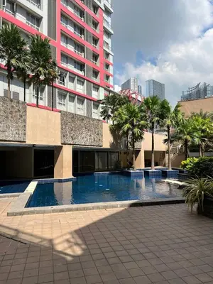 a large swimming pool in front of a building at Singapore Theme Sunshine 100 Tower 3 Pioneer Free Pool Gym Internet Netflix in Manila