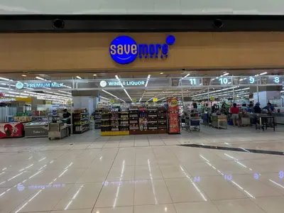 a shopping mall with a s save mops sign in it at Greece Theme Boni MRT Train Edsa 1BR with Netflix Fast Internet Pool Light Mall in Manila