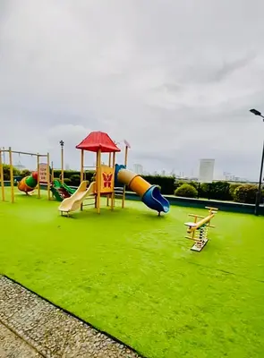 a playground with a slide and slidesktop at Mezza Residences in Manila