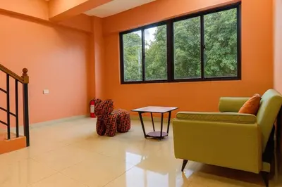 a living room with a couch and a table at T1 Stay Manila-Near NAIA Manila Airport and PITX in Manila