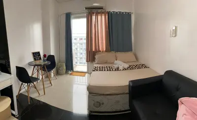 a small room with a bed and a couch at Zia Preaecious Stay in Manila