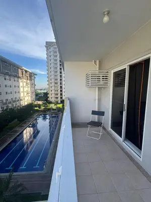 a balcony of a building with a swimming pool at J Suite in Manila