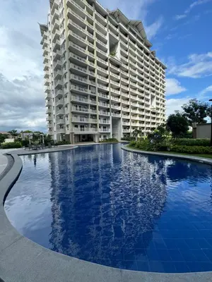 a large apartment building with a large swimming pool at J Suite in Manila