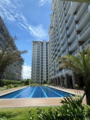 a swimming pool in front of a building at J Suite in Manila