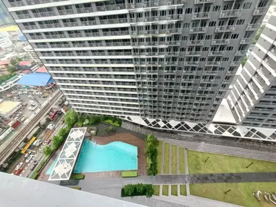 an overhead view of a large building with a pool at Japan Vibe Shaw MRT Train EDSA 1BR with Veranda Netflix Internet Pool View in Manila