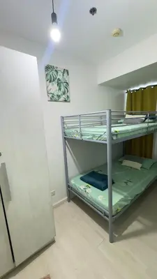 a room with a bunk bed in a room at 2- Bedroom Condo in Metro Manila - Azure Beach in Manila